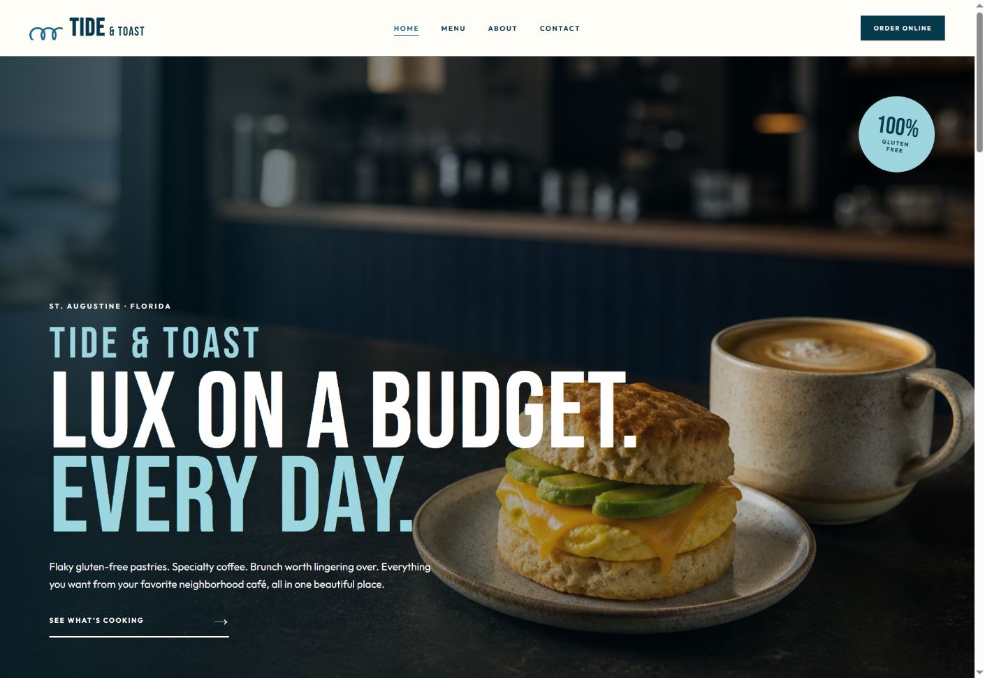 Desktop homepage of the Tide and Toast cafe concept, showing its header, Lux on a Budget message, breakfast sandwich and coffee.